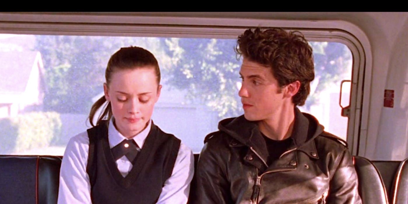 Alexis Bledel's Rory and Milo Ventimiglia's Jess sit at the back of the bus in Gilmore Girls