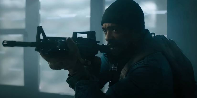 Anthony Mackie holding a rifle in Elevation