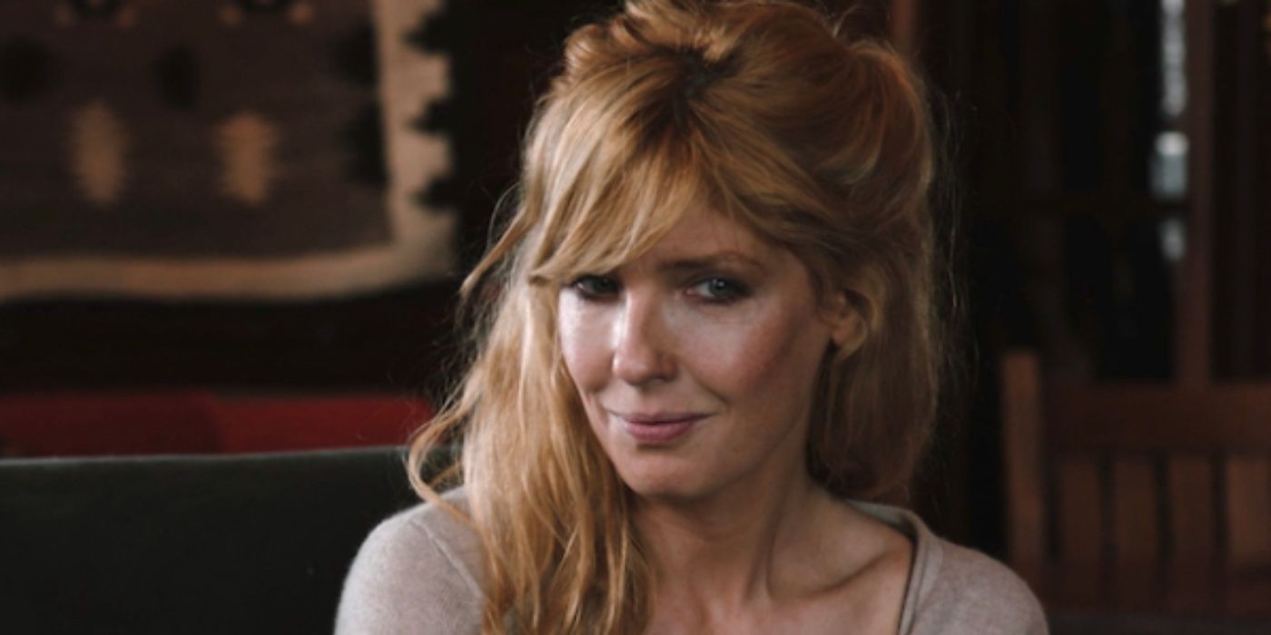 Beth Dutton (Kelly Reilly) smiling at somone in Yellowstone. copy