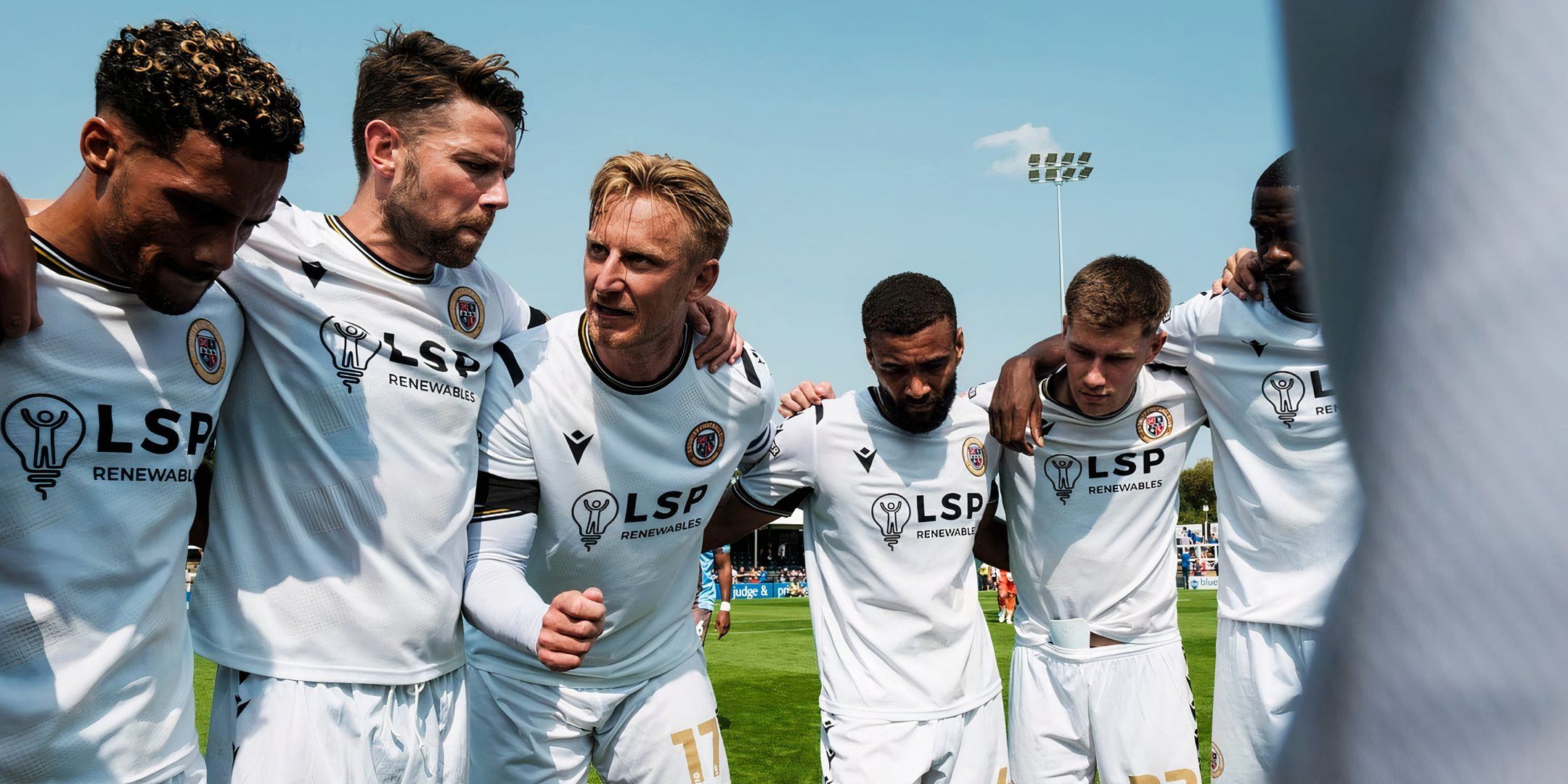 Bromley FC Team Huddle in white arrival kit