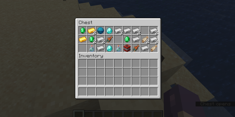 Player opening a chest of Buried Treasure, containing Diamonds, Fish, Iron Ingots, and other treasures in Minecraft.