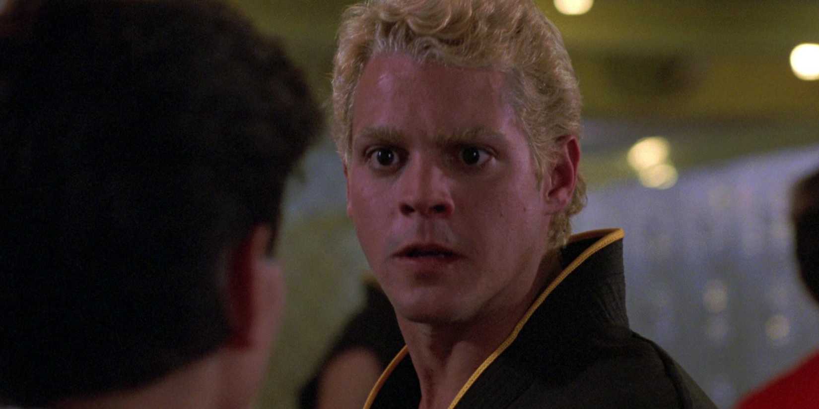 Chad McQueen makes an intimidating face in The Karate Kid