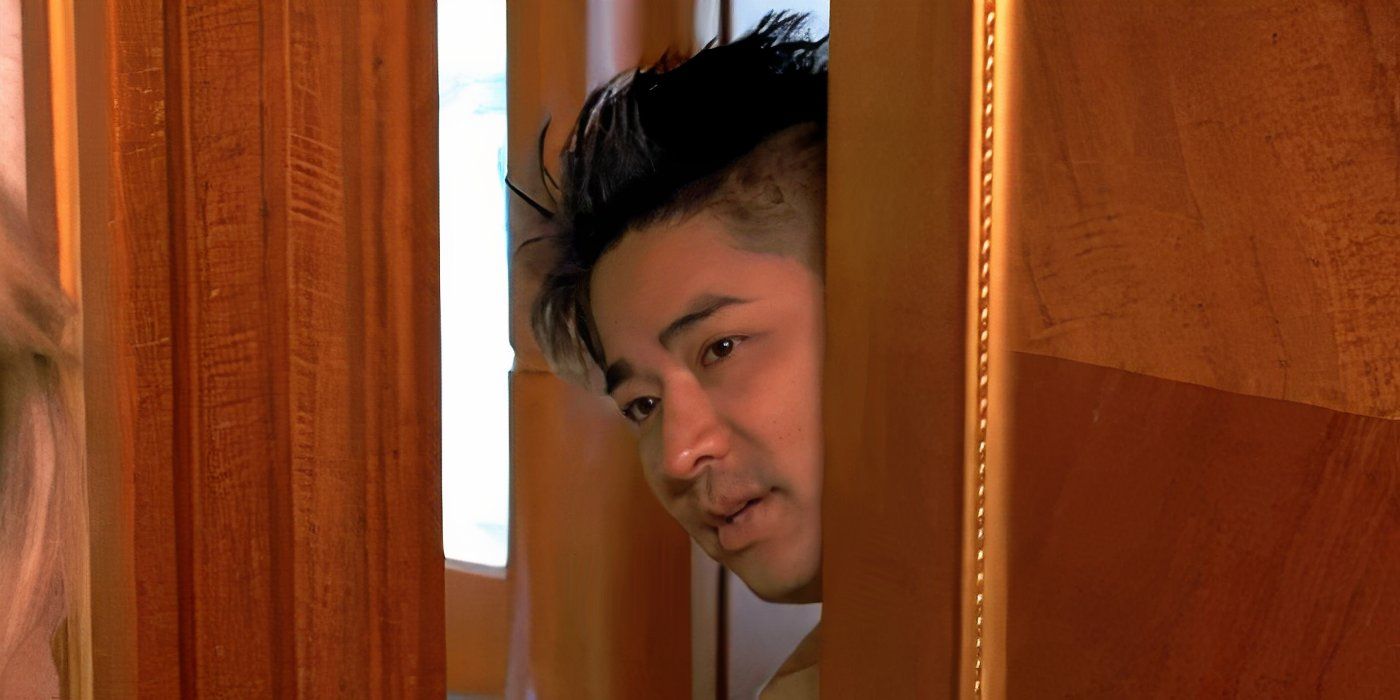 Charles Yim sticking his head out of the door in Below Deck