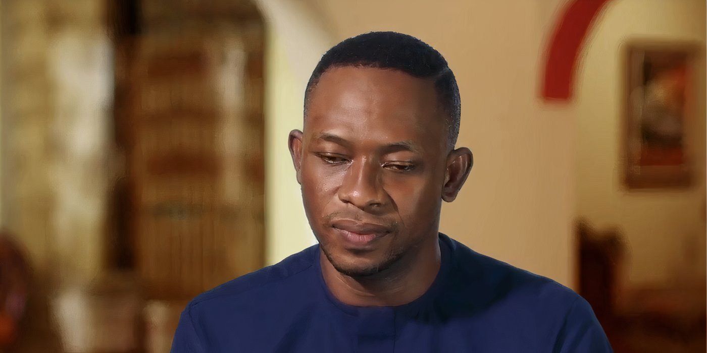 Chidi Ikpeamaeze in 90 Day Fiance in blue shirt looking down during confessional