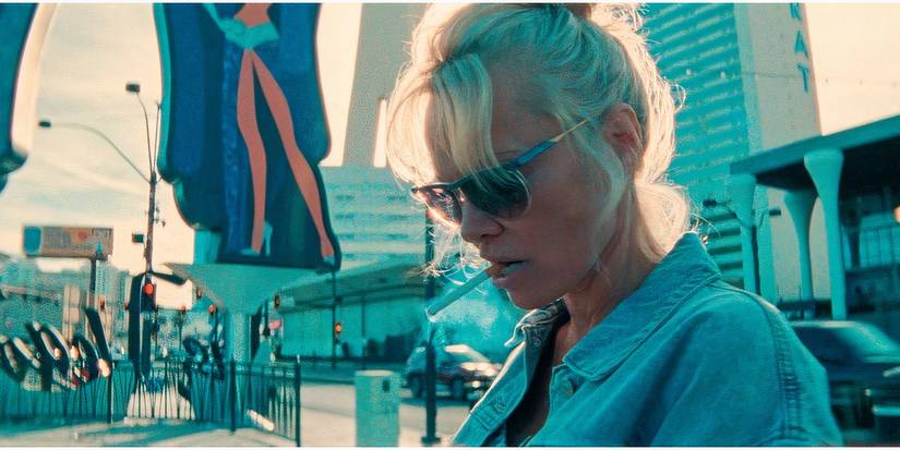 Close up of Pamela Anderson holding a cigarette between her teeth in The Last Showgirl