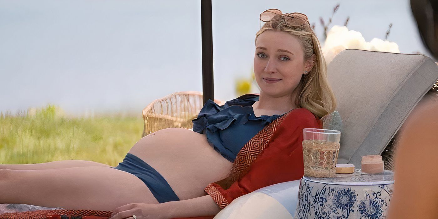 Dakota Fanning as Abby in The Perfect Couple lounging by the pool while talking to Amelia