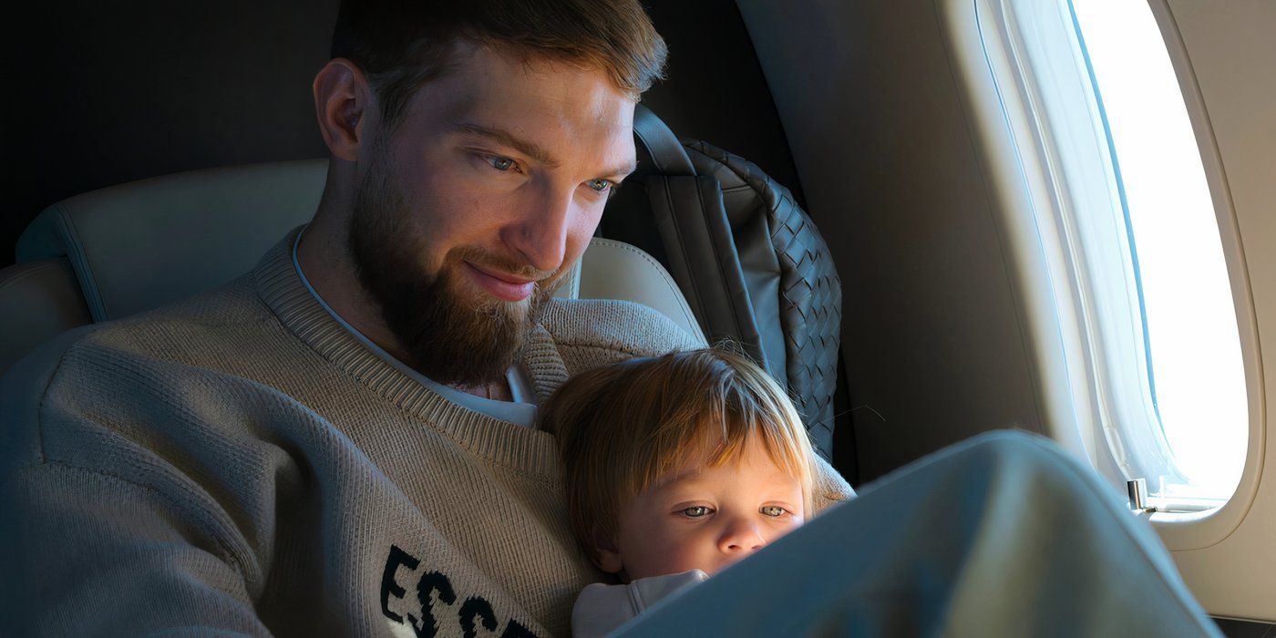 Domantas Sabonis watching a video with his child in Starting 5