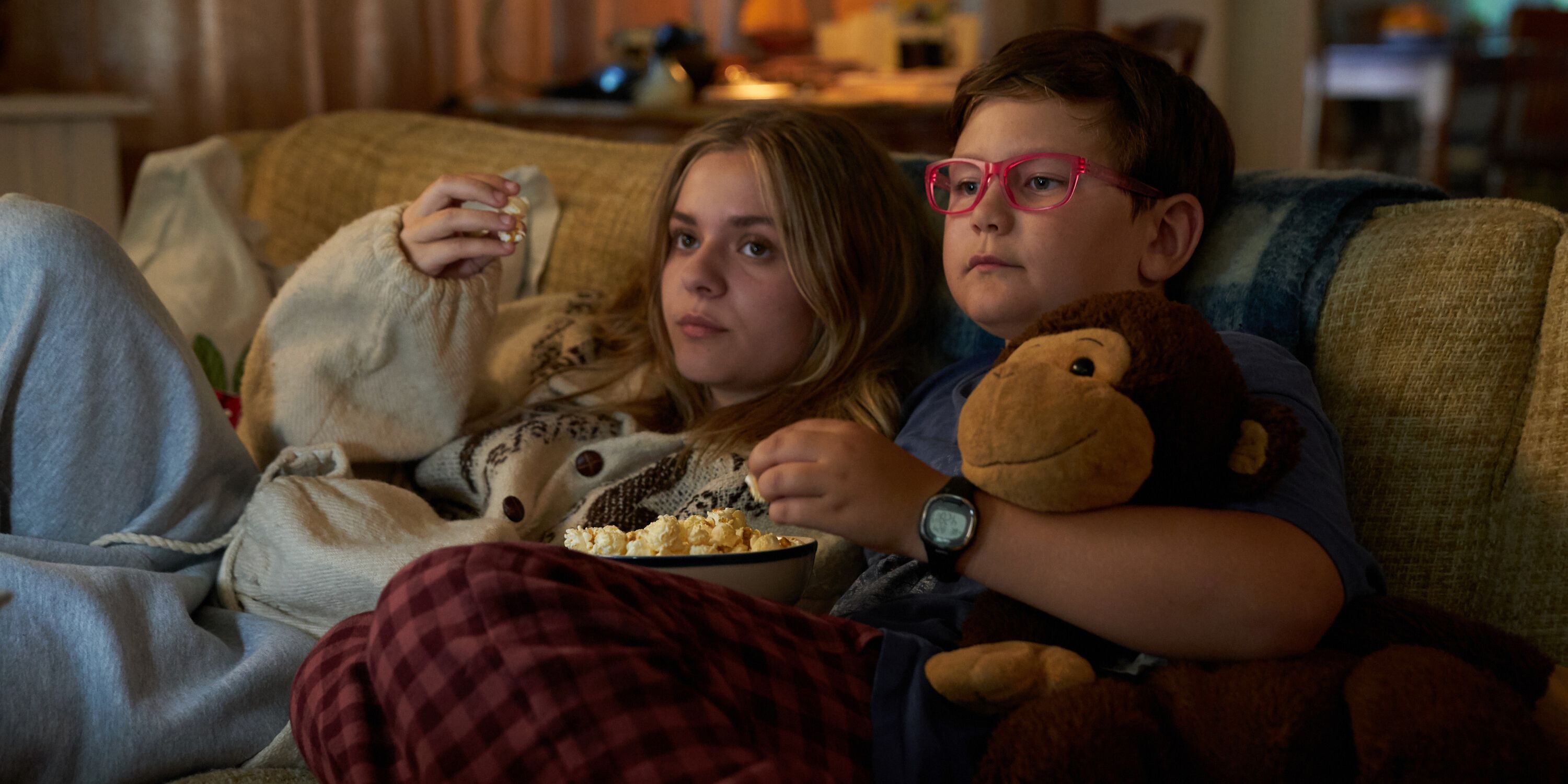 Elliott (Maisy Stella) and Spencer (Carter Trozzolo) eating popcorn together in My Old Ass.