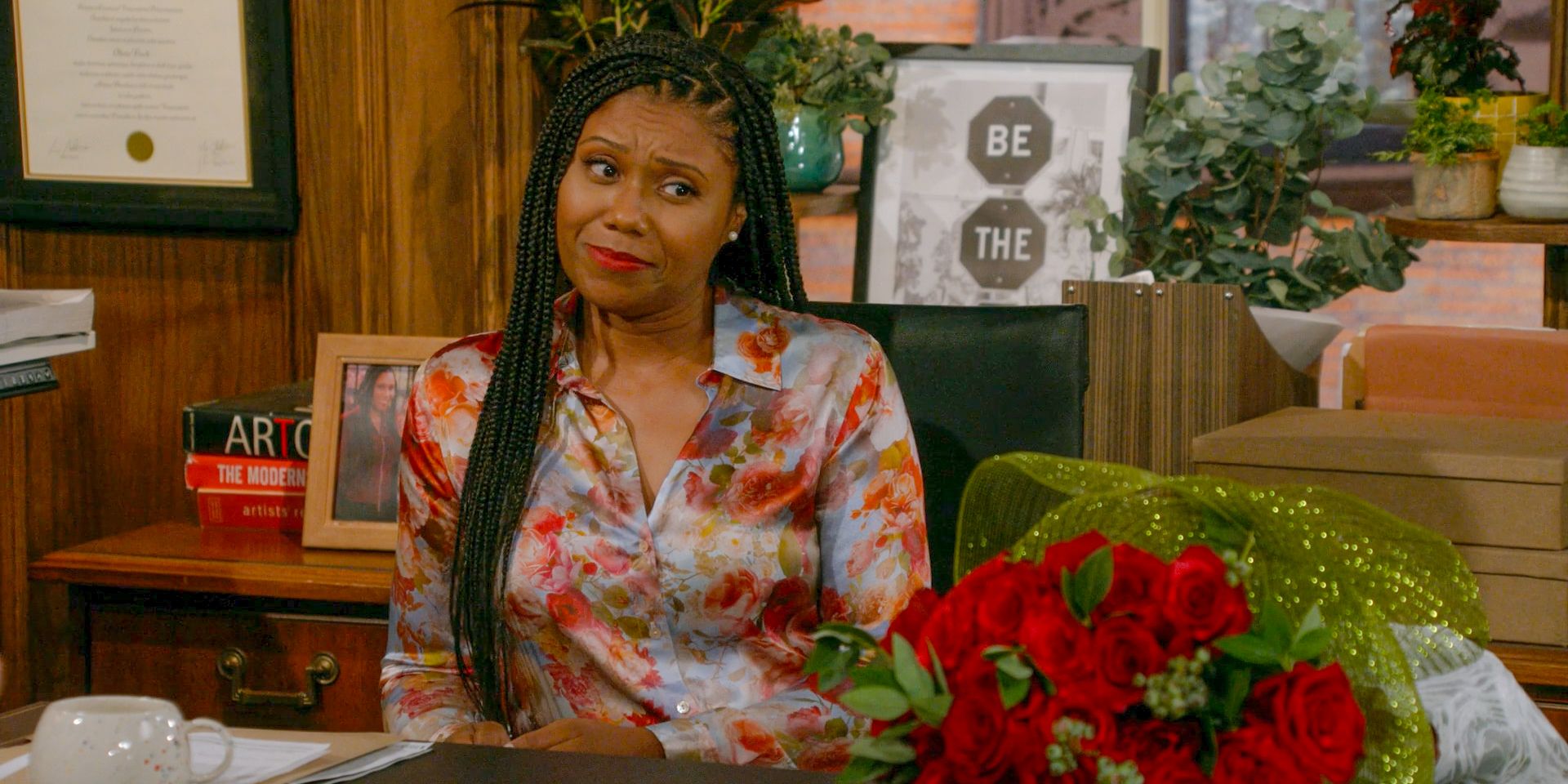 Olivia (Toks Olagundoye) receives a bouquet of roses in Frasier (2023) Season 2 Episode 2