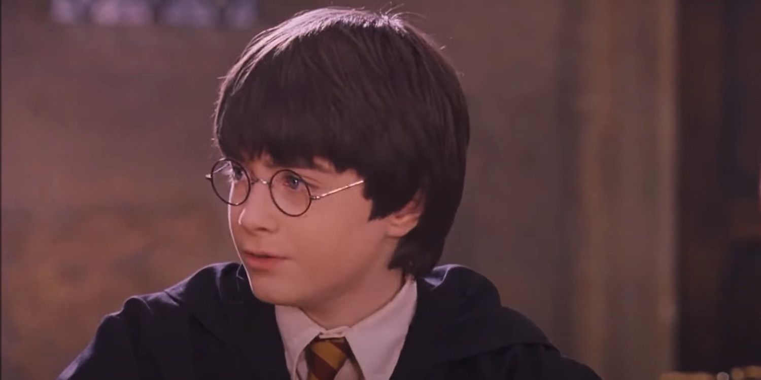 Daniel Radcliffe as Harry Potter looking at Professor McGonagall in Sorcerer's Stone