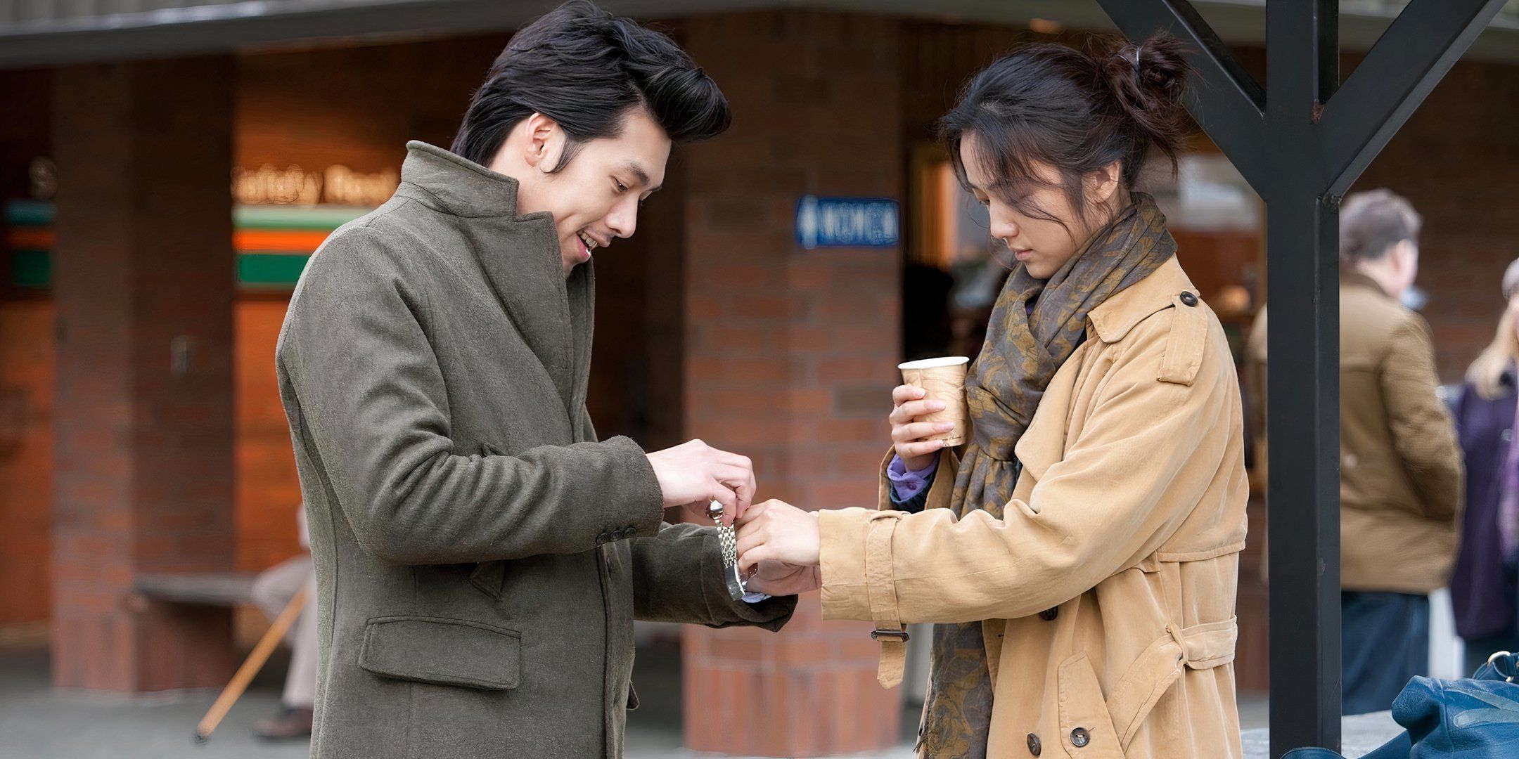 Hyun Bin puts a watch on Tang Wei's wrist.