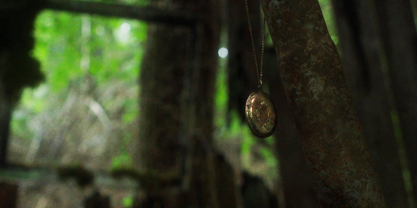 In A Violent Nature golden locket over Johnny's grave at the fire tower