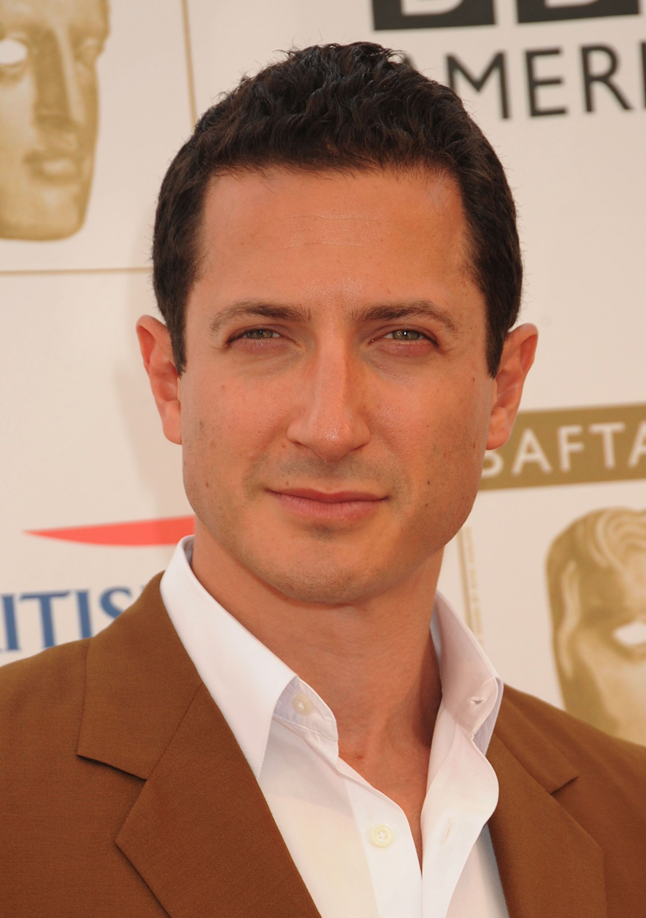 Headshot Of Sasha Roiz