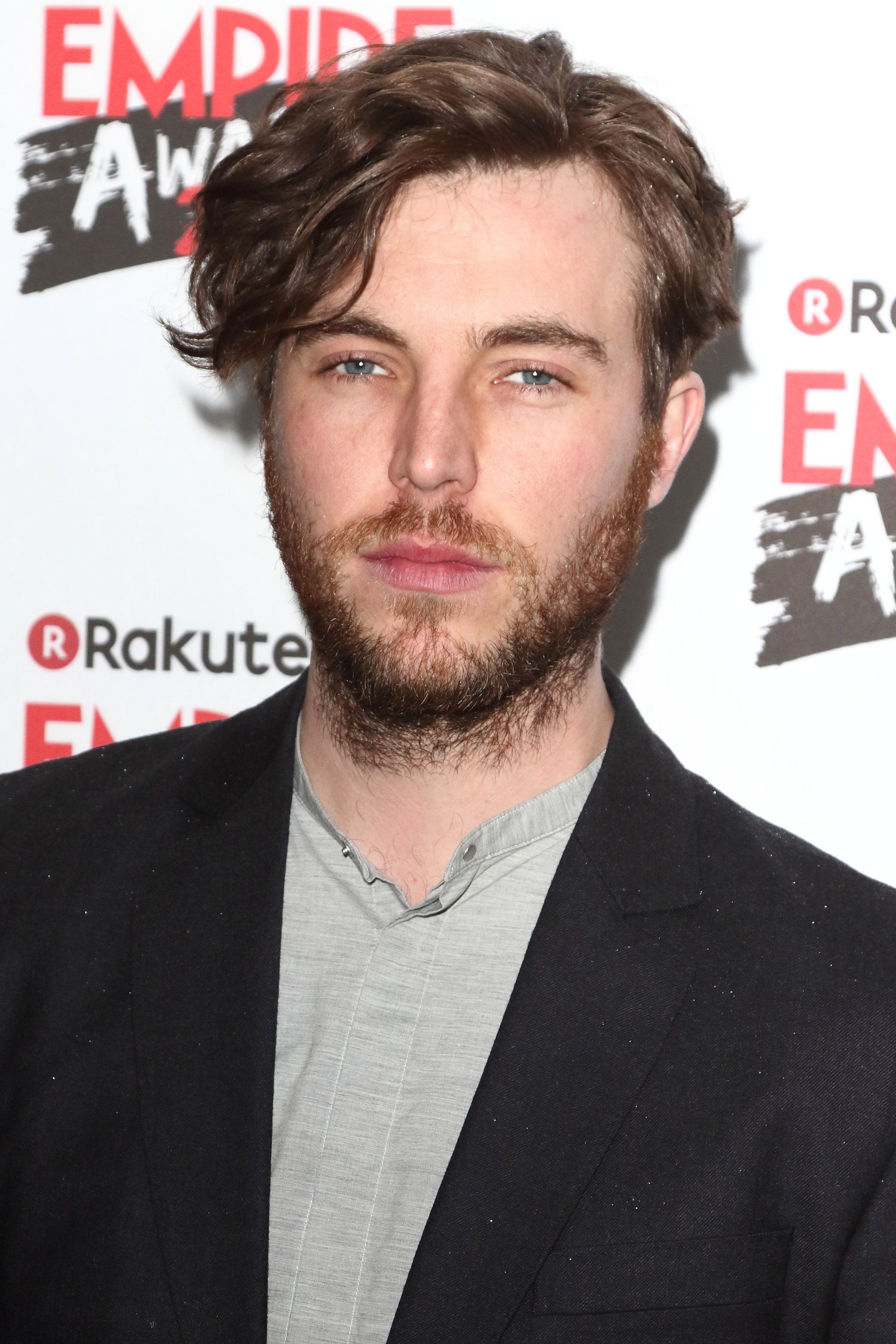 Headshot Of Tom Hughes