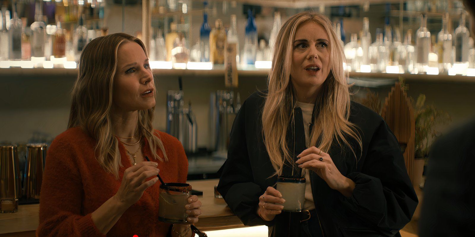 Joanne and Morgan hold drinks at the bar in Nobody Wants This season 1 episode 2