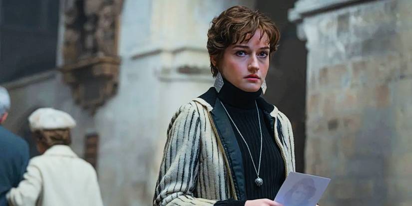 Julia Garner as Terry looking nervous holding a photo in Apartment 7A