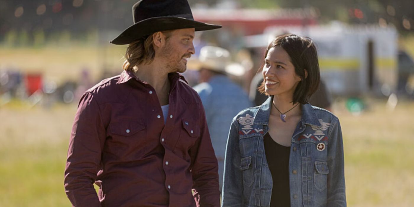 Kayce (Luke Grimes) smiling at Monica (Kelsey Asbille) in Yellowstone.