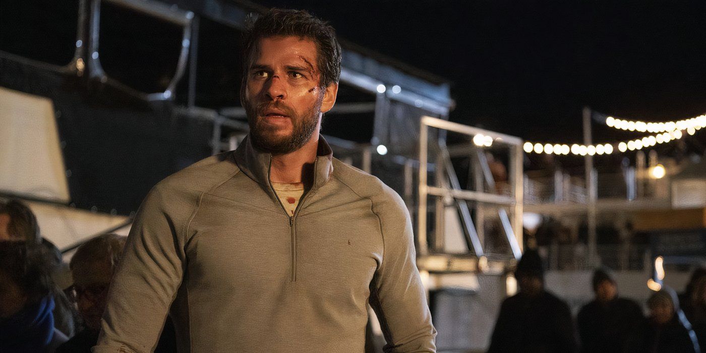 Liam Hemsworth as Dodge standing outside in Most Dangerous Game