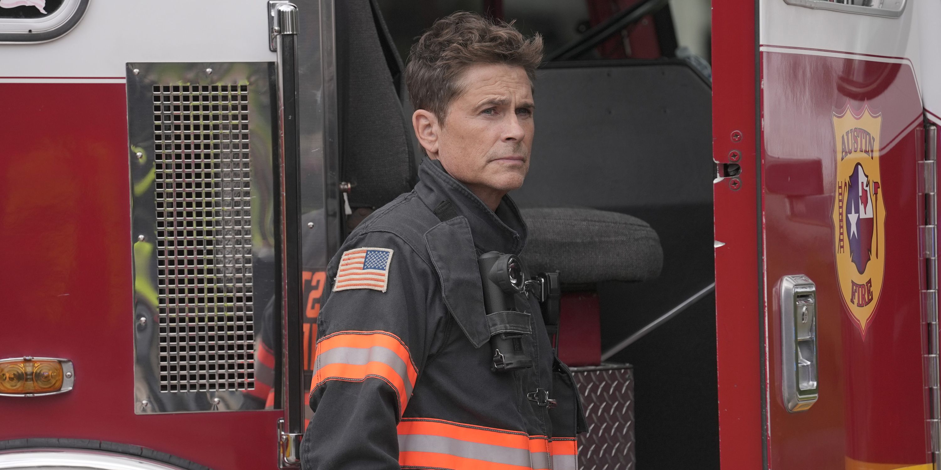 Owen standing by the fire truck in 9-1-1: Lone Star season 5, episode 1.