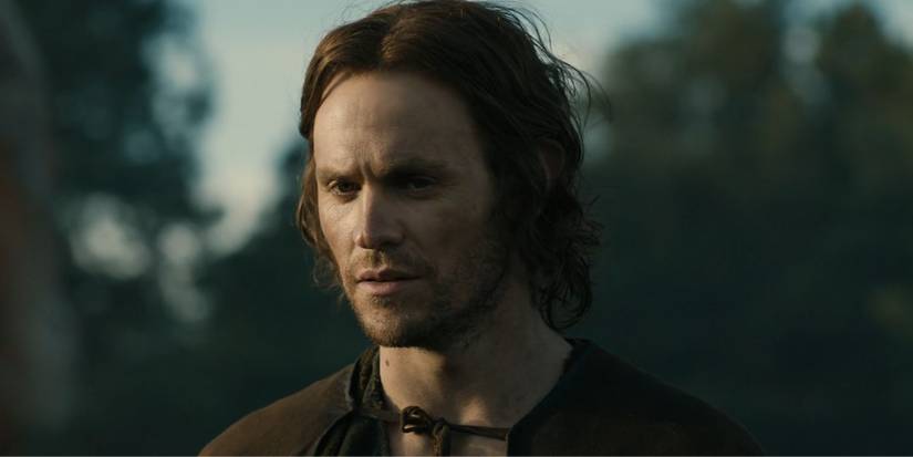 Sauron as Halbrand played by Charlie Vickers standing in The Lord of the Rings: The Rings of Power.