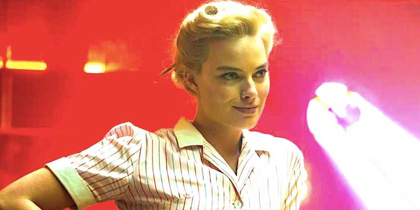 Margot Robbie's smiling waitress in a red diner from Terminal