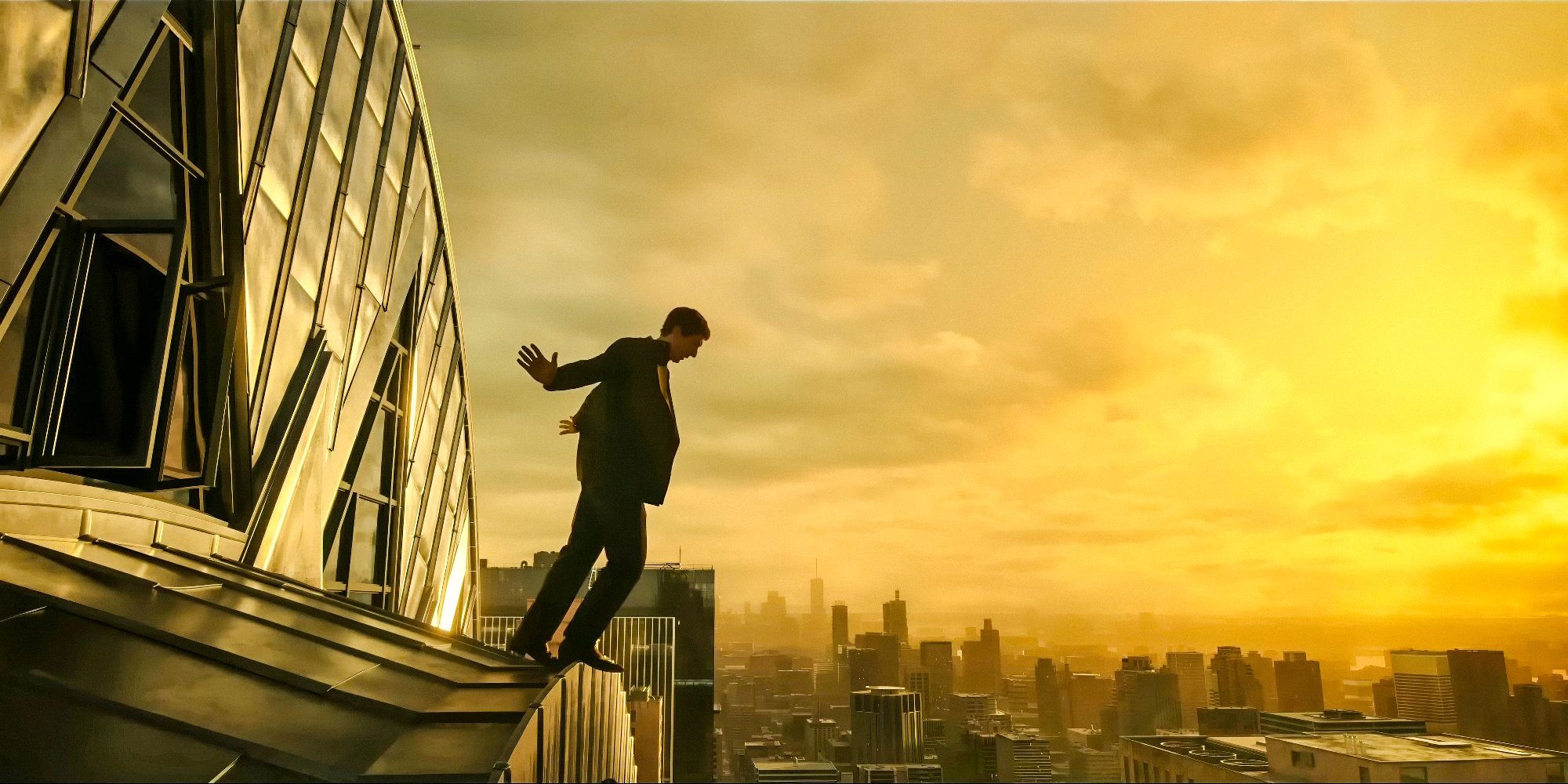 Cesar Catilina (Adam Driver) standing on top of the Chrysler Building in Megalopolis (2024)