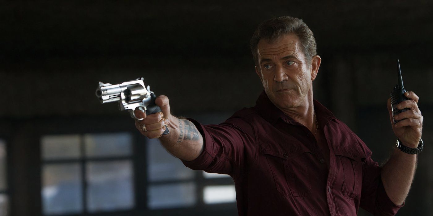 Mel Gibson aims a revolver in Expendables 3