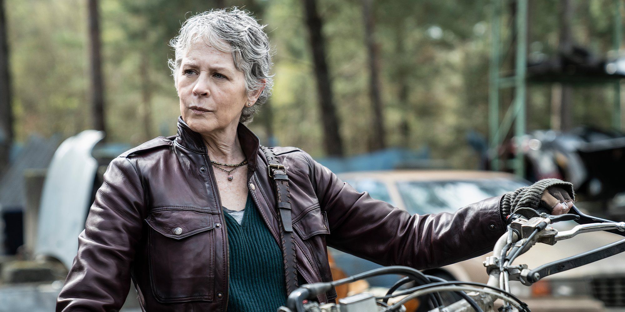 Carol sits on a motorcycle in Daryl Dixon