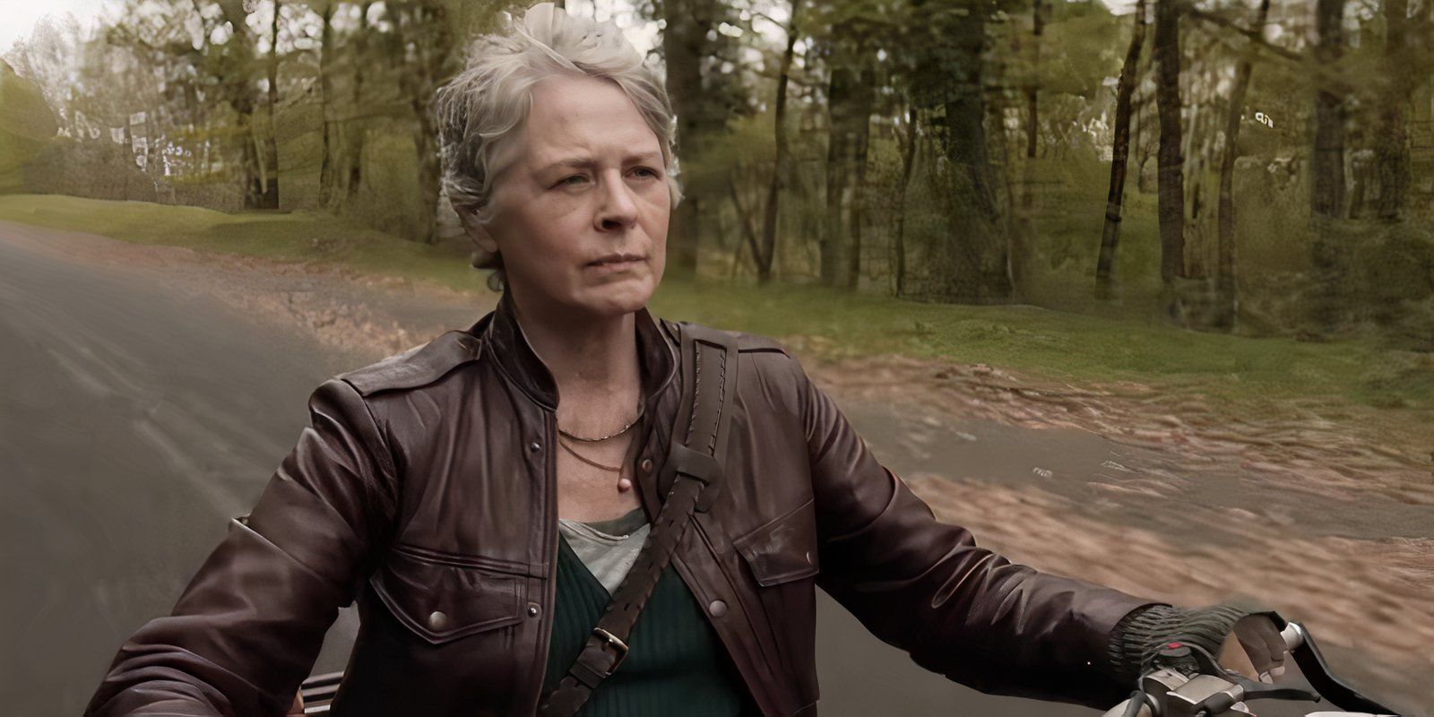 Melissa McBride as Carol riding a motorcycle in The Walking Dead: Daryl Dixon