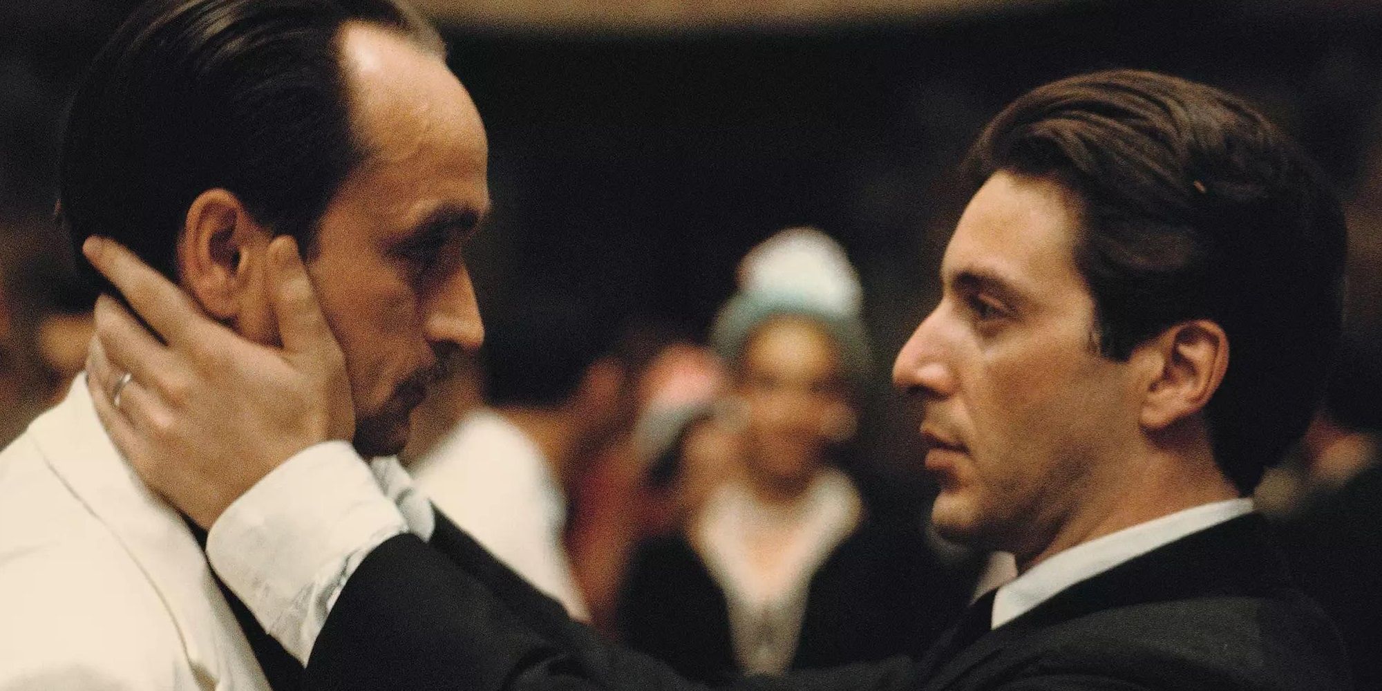 Michael (Al Pacino) holds Fredo's (John Cazale) face in The Godfather Part II.