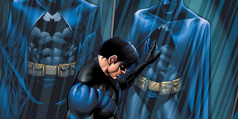 Comic book art: Nightwing looking sad in front of a case of Batman suits.