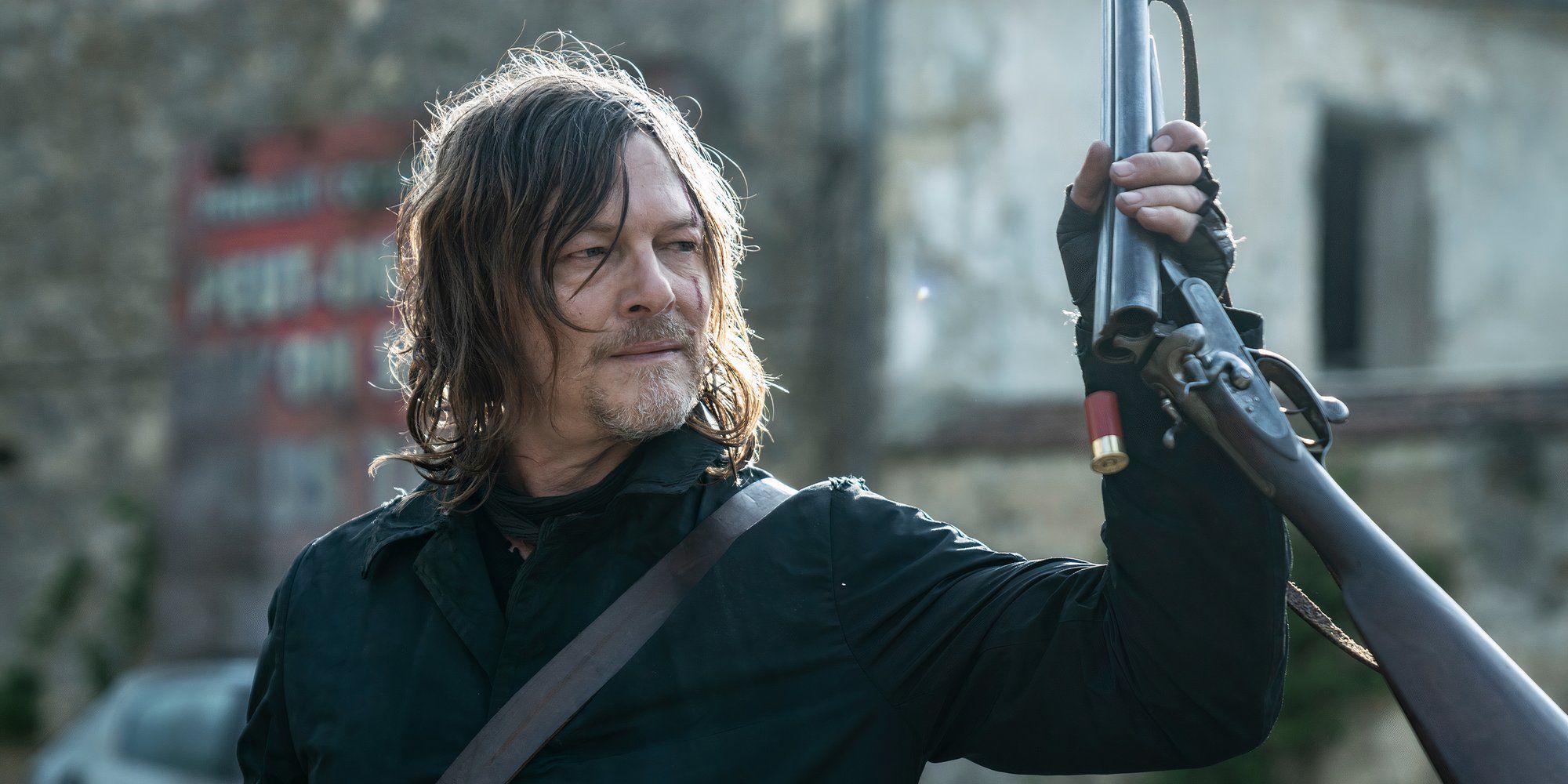 Daryl holds a shotgun in The Walking Dead Daryl Dixon