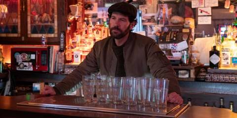 Paul Rudd standing behind a bar in Only Murders in the Building
