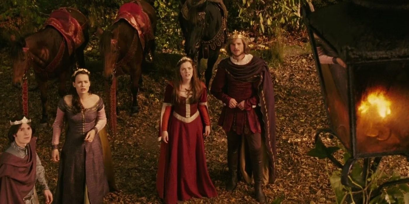 the Pevensies as adults in the woods of Narnia, all dressed as royalty