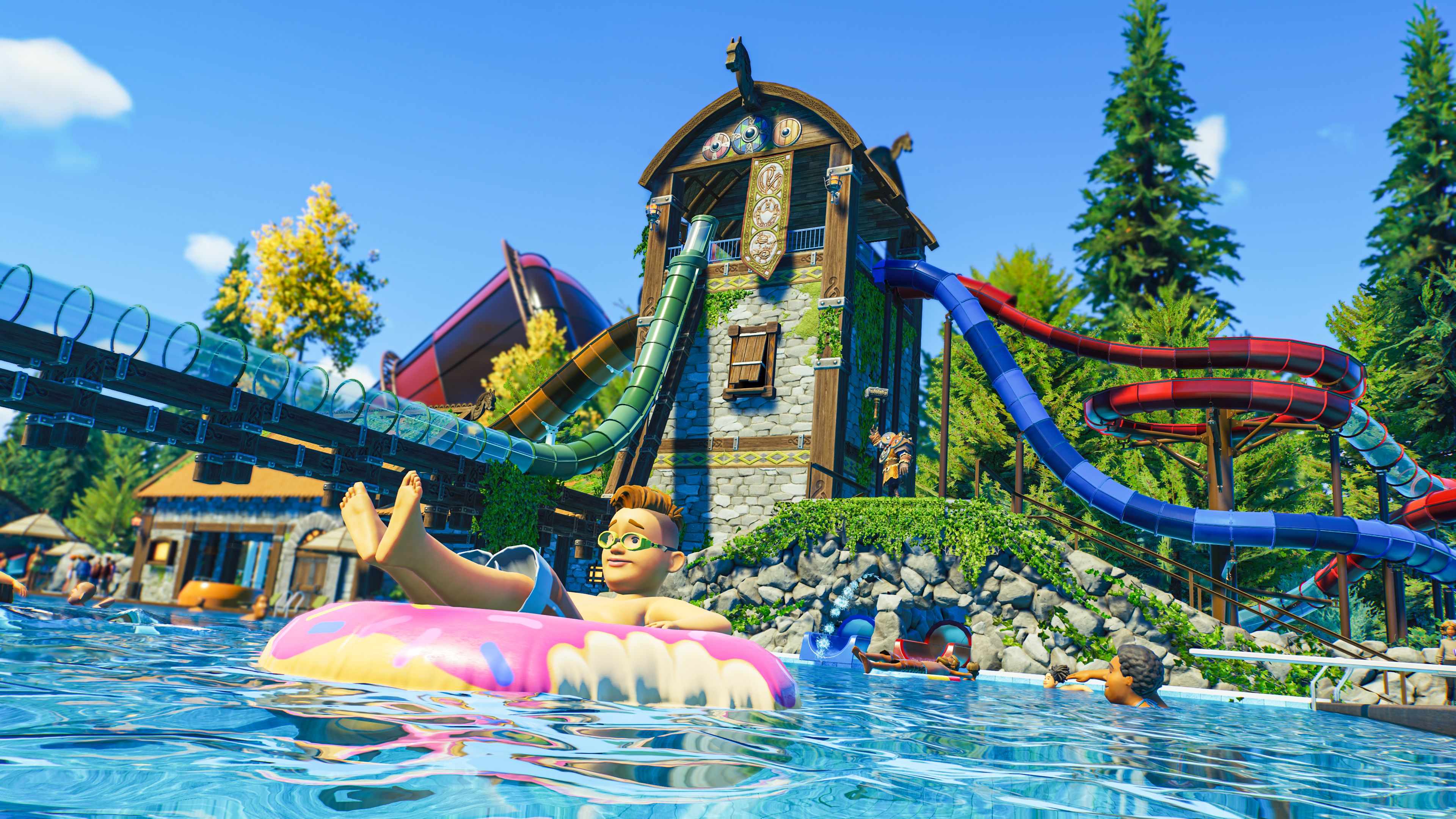 Peças do Planet Coaster 2 Viking Set aparecendo com calhas saindo e uma criança em um donut inflável na piscina abaixo.