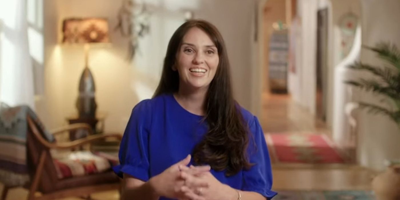 Rayne Hernandez in 90 Day Fiancé in blue shirt during interview smiling