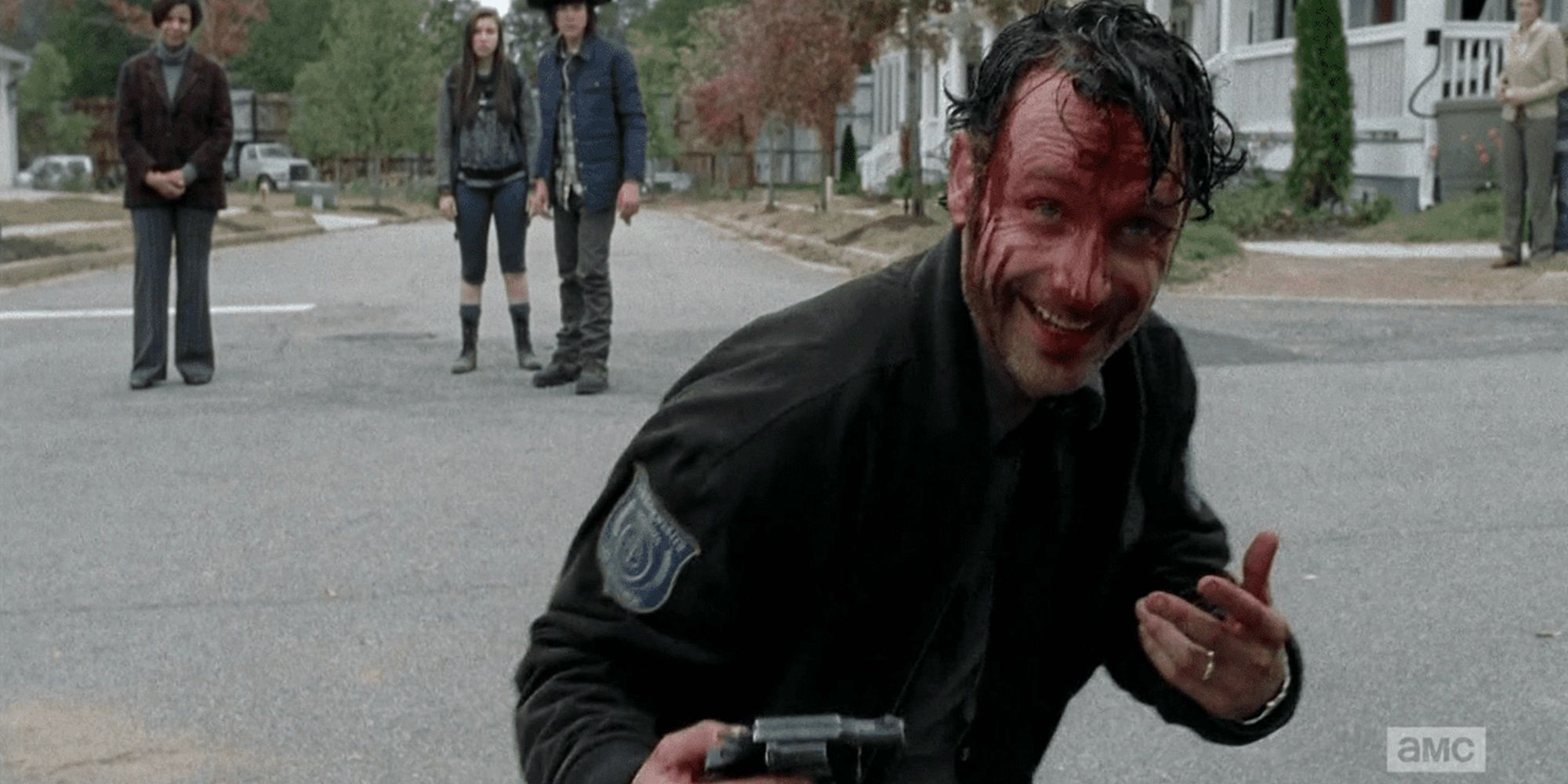 Rick coberto de sangue e rindo em The Walking Dead