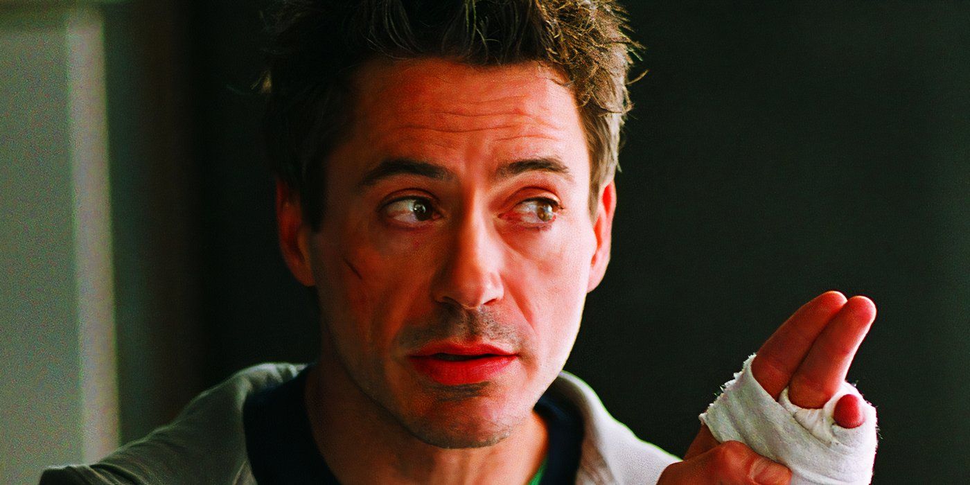 Robert Downey Jr. como Harry Lockhart con las manos vendadas en Kiss Kiss Bang Bang