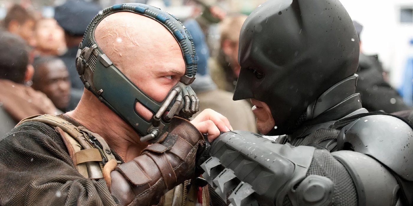 Tom Hardy as Bane grappling with Christian Bale as Batman in The Dark Knight Rises