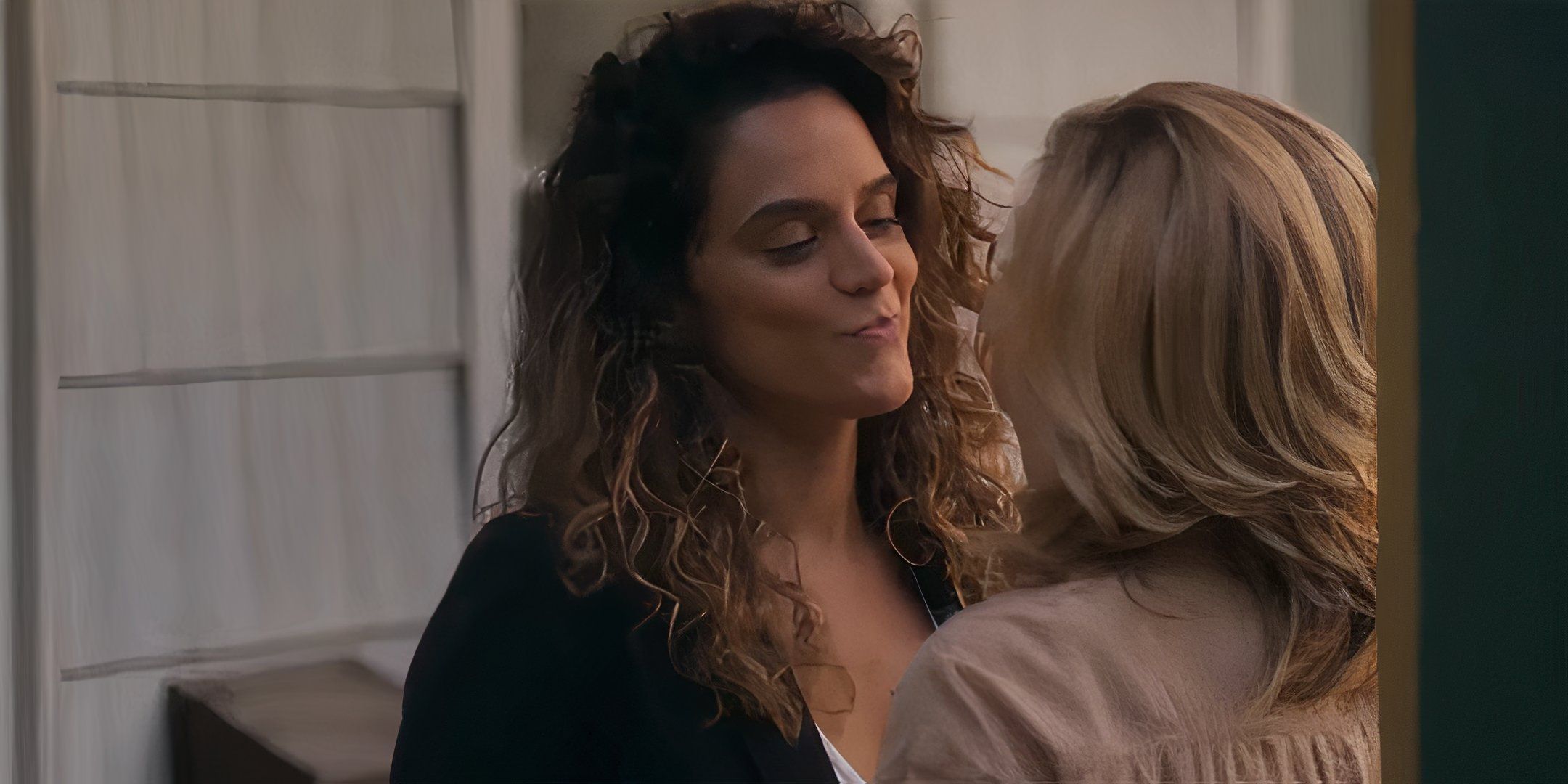 Sepideh Moafi flirting with Edie Falco's Wanda on her porch in I'll Be Right There
