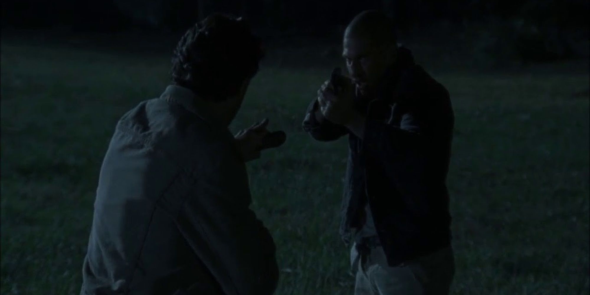 Shane holds Rick at gunpoint in The Walking Dead