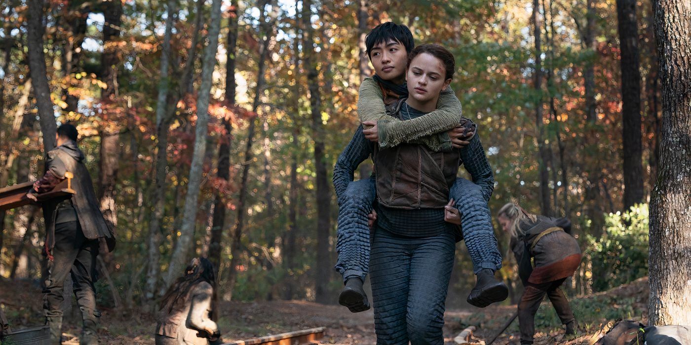 Shay (Brianne Tju) and Tally (Joey King) walking down the train tracks in The Smoke in Uglies