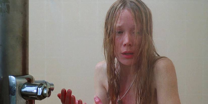 Sissy Spacek as Carrie White looking distressed in the shower in Carrie