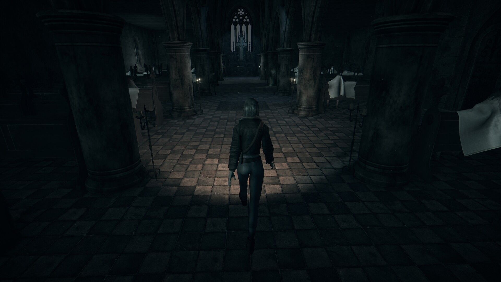 Mica from Hollowbody walks into a dark church with a flashlight.