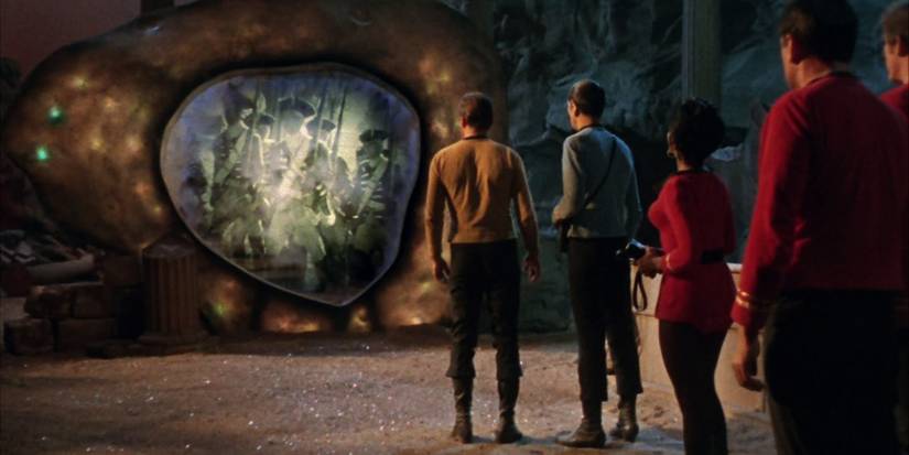 The Enterprise crew facing the Guardian of Forever in Star Trek.