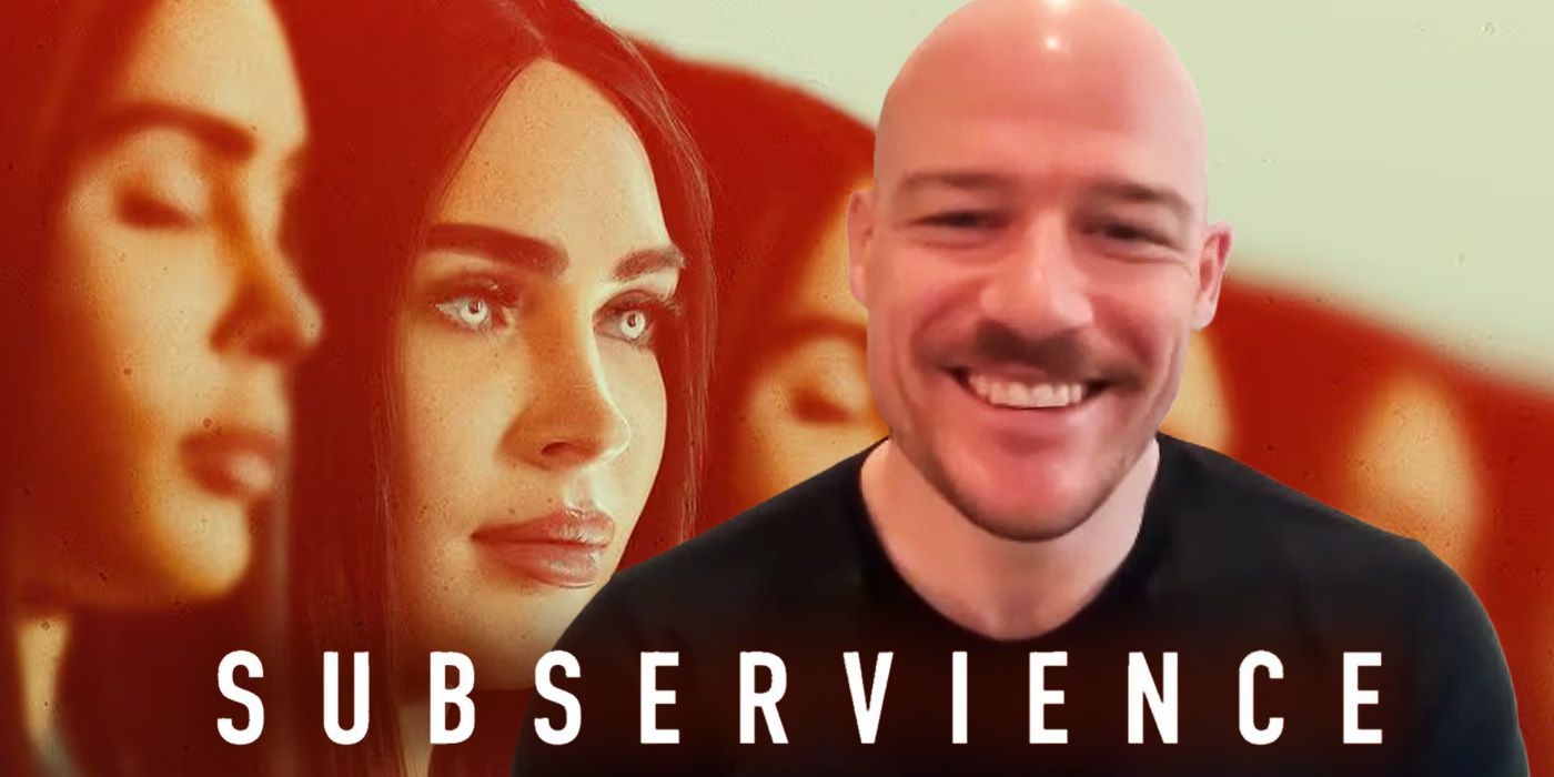 S.K. Dale smiling during Subservience interview with Megan Fox as robot in the background