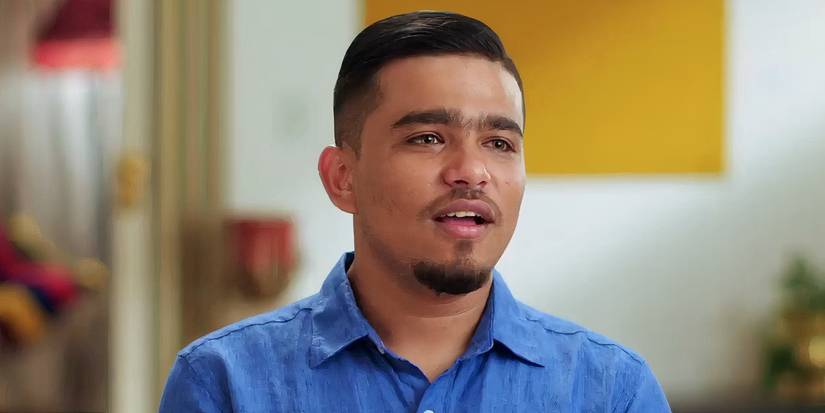 Sunny in 90 Day Fiance during interview wearing blue shirt