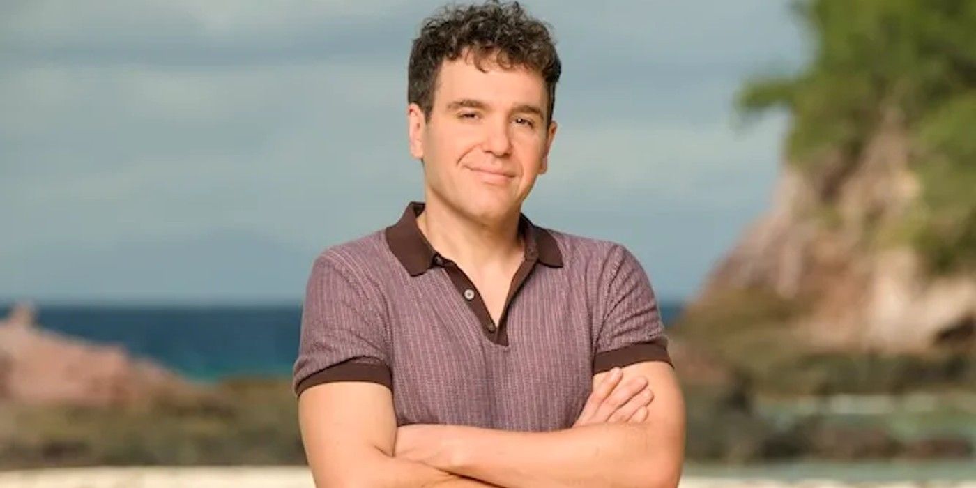 Survivor 47's Jon Lovett smiling in a headshot on a beach in Fiji.