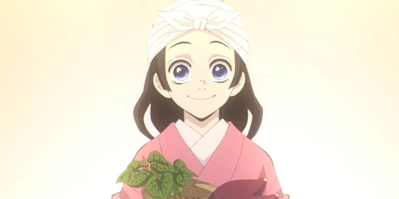 Suyako Kamado holds a plant with a smile on her face