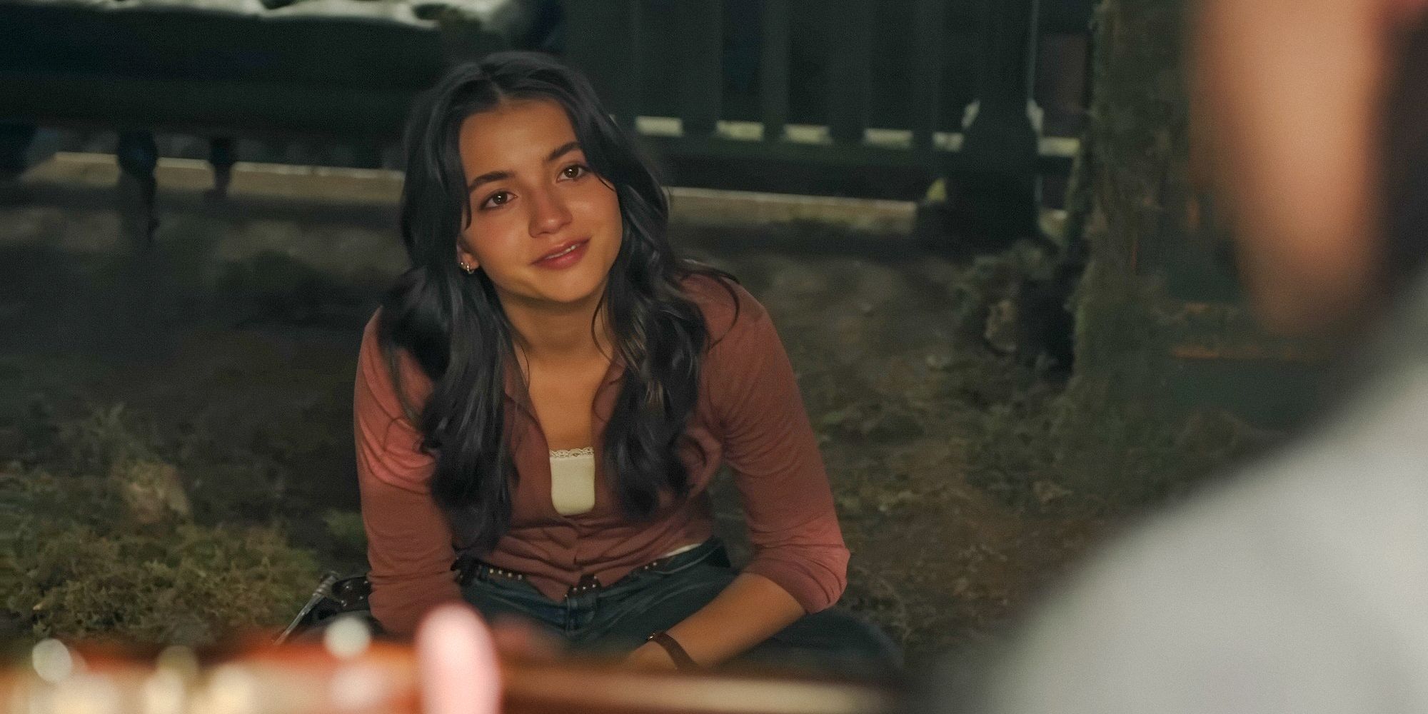 Dina (Isabela Merced) watching Ellie play the guitar in The Last of Us Season 2 Teaser